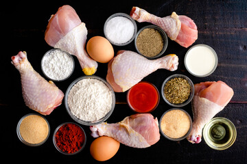 Canvas Print - Ingredients for Air Fryer Southern Fried Chicken Drumsticks: Raw chicken legs, flour, spices, and other ingredients for southern fried chicken