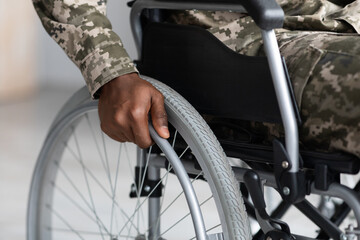 Wall Mural - Unrecognizable african american soldier sitting in wheelchair