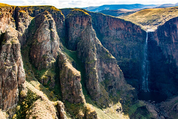 Wall Mural - Travel to Lesotho. A view of Maletsunyane Waterfall and the cliffs surrounding the canyon