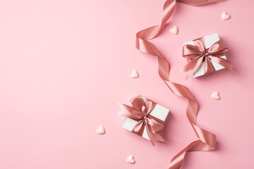 top view photo of valentine's day decorations curly silk ribbon two small gift boxes with bows and s