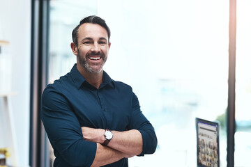 Aufkleber - Im building my own empire. Portrait of a mature businessman standing in his office.