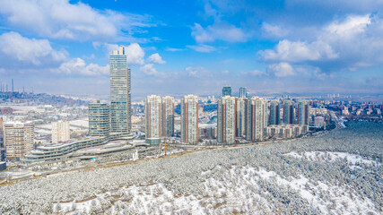 Aerial view of snowy forest and skyscrapers in Capital Of Turkey,ANKARA.