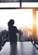 © Delmaine D/peopleimages.com - The boss of the business empire. Silhouetted shot of a young businesswoman looking at a cityscape from an office window.