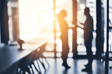 Poster - Teaming up to push through towards great success. Defocused shot of two businesspeople having a discussion in an office.