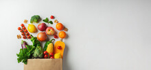 Delivery Healthy Food Background. Healthy Vegan Vegetarian Food In Paper Bag Vegetables And Fruits On White, Copy Space, Banner. Shopping Food Supermarket And Clean Vegan Eating Concept