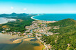 aerial photo with drone of mozambique beach, barra da lagoon and conceição lagoon in the afternoon in florianópolis Santa Catarina Brazil