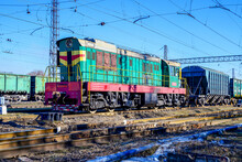 Diesel Locomotive With Electric Transmission On A Railway Track With Wagons 