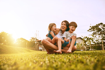 her boys fill her life with joy. cropped shot of a young family spending time together outdoors.