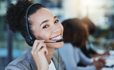 Wall Mural - well leave you smiling too by the end of the call. portrait of a young woman working in a call centr