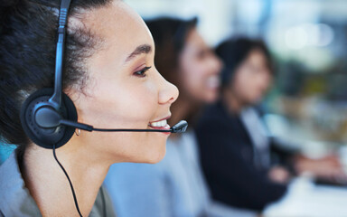 Wall Mural - tell me more about the problem and i will resolve it. shot of a young woman working in a call centre