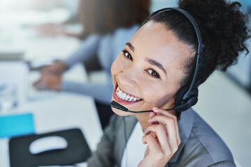 Wall Mural - the customer always comes first. portrait of a young woman working in a call centre.