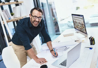 Aufkleber - Im so inspired by the internet. Shot of a mature male architect working on his laptop.