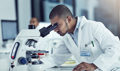  Success never rests, neither do diseases. Cropped shot of a young male scientist working in his lab.