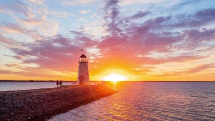 Wall Mural - Sunset time lapse of the beautiful afterglow over the lighthouse of Lake Hefner