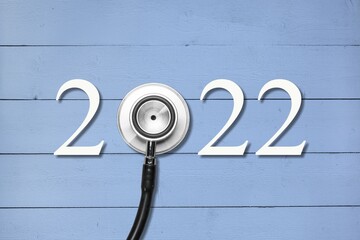 Sticker - Stethoscope with 2022 number on background. Happy New Year for healthcare, Insurance