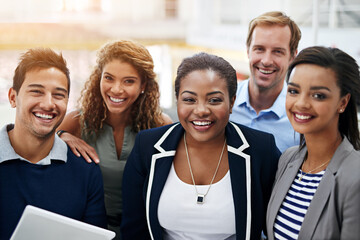 Poster - together, success is a given. portrait of a group of smiling coworkers standing in an office.