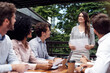 © Jadon Bester/peopleimages.com - Presenting her opinion on business progress. Cropped shot of an attractive young businesswoman standing and giving a presentation to her seated colleagues outdoors.