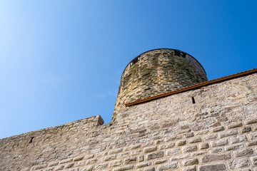 Poster - A bottom shot of a fortress in the daytime.