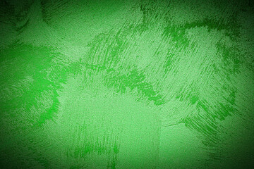 Texture of green decorative plaster or concrete with vignette.