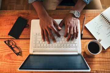 Aufkleber - Responding to customer emails. High angle shot of an unrecognizable businessman sitting alone in his home office and typing on his laptop.