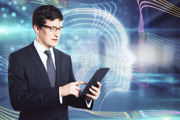 Canvas Print - Attractive young european businessman with smartphone standing in blurry office interior with abstract glowing tech head outline hologram. Machine learning and ai concept. Double exposure.