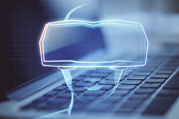 Aufkleber - Close up of laptop with abstract hologram of digital head with VR glasses on blurry background. Virtual reality and technology concept. Double exposure.