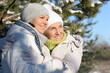 © aletia2011 - happy woman with mother   in winter clothes posing outdoors