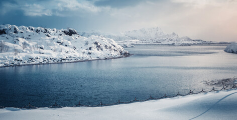 Amazing beautiful nature landscape of Lofoten Islands. Amazing winter scenery with snow covered mountains during sunset. popular travel location