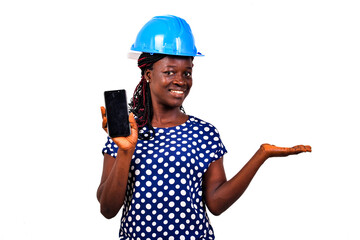 Wall Mural - close-up of a beautiful female engineer presenting cellphone, smiling.