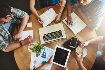 Poster - Sharing information thatll help them pass their exams. High angle shot of a group of students studying in a coffee shop.