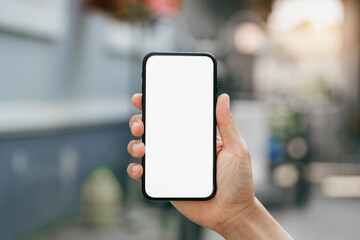 Male hand holding smartphone with white screen.