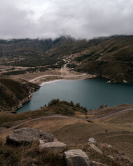 Wall Mural - mountain lake with turquoise water on a cloudy day. elbrus region