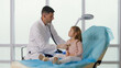 © alex_marina - Child Patient Visits the Doctor'S Office. The Doctor Listens to the Lungs of the Child With a Stethoscope, Speaks Caringly with the Little Girl. Comfortable Stay of the Child in the Clinic.