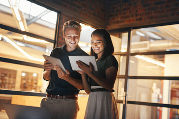 Aufkleber - Putting their best productivity feet forward. Shot of two designers using their digital tablets while working nightshift.