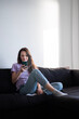 © Yurii Kushniruk - The morning routine of a young woman using her phone