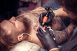 © Mr. Prof - Professional tattoo artist makes a tattoo on the client's