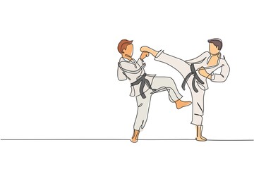 Poster - single continuous line drawing two young confident karateka men in kimono practicing karate combat a