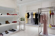 © Goncharuk film - Women clothing store and accessories in shopping mall. Luxury and fashionable interior of cloth store.
