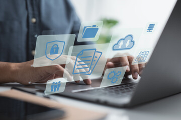 Poster - Businessman manages documents on a laptop. Online document database software, as well as a digital file storage system and file access concept. Enterprise resource planning (ERP).