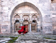 Semazen (dervish) is dancing in the traditional red dress. february 5, 2021. izmir, Turkey.