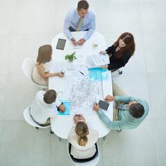 Poster - theyre a dedicated group. high angle shot of a group of businesspeople meeting in the office.