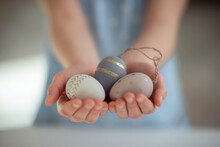 Close Up Photo Of Childs Hands Holding Easter Eggs
