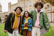 © Drobot Dean - Multiracial students laughing and hugging at university park