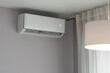 © Yurii Klymko - Split system of air conditioner or heat pump operating in home interior