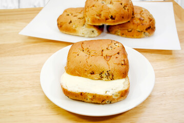 Wall Mural - A Buttered Onion Roll Served on a White Plate