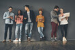 © Camerene Pendl/peopleimages.com - We take every opportunity to social network. Studio shot of a diverse group of creative employees social networking inside.