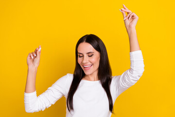 Wall Mural - Photo of young adorable woman have fun dancing clubber free-time isolated over yellow color background