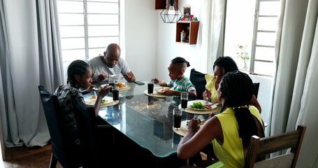 Wall Mural - Black African family eating lunch together