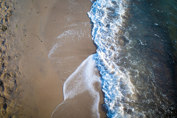 Wall Mural - the waves of the sea wash up on a beach