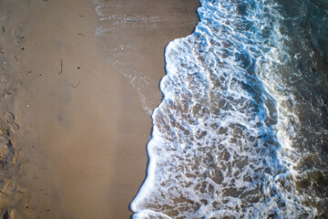 Wall Mural - the waves of the sea wash up on a beach